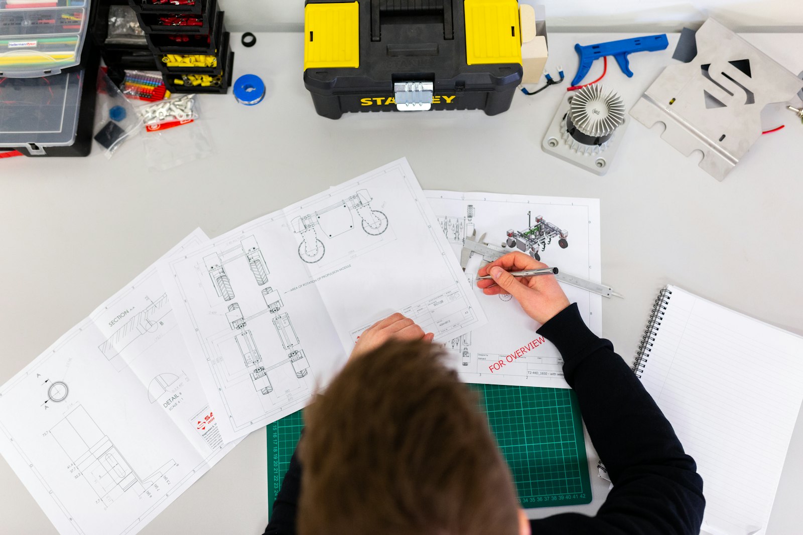 Manufacturing engineer working with controlled technical data on the shop floor